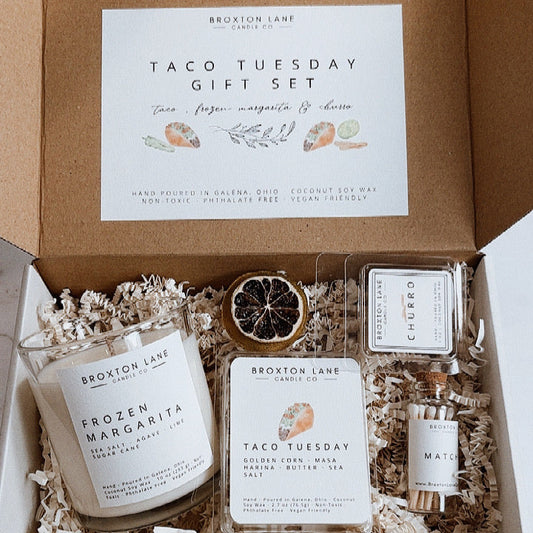 Broxton Lane Taco Tuesday gift set with candles and packaging on a marble surface